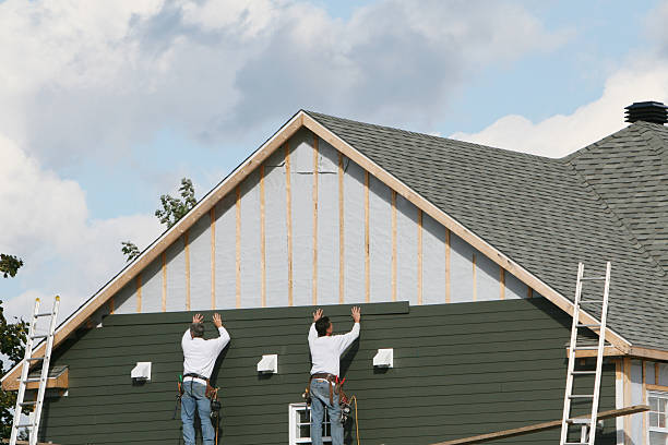 Professional Storm Damage Siding Repair technician working in Ararat, NC